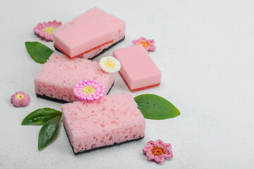 Various sponges for washing dishes. Organic cleaning concept, lemon freshness. Stone background
