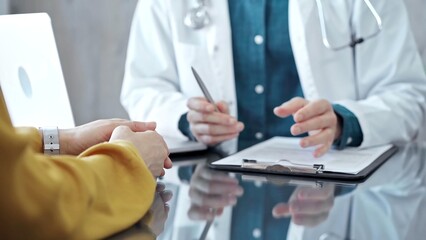 Doctor and patient consultation in clinic. Medicine and health care