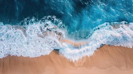 Fotobehang Aerial perspective of azure waves softly touching the sandy shore, evoking tranquility and beauty. © KYR