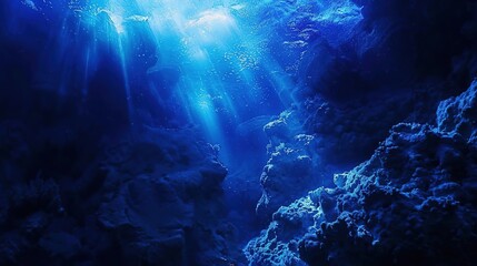 Obraz premium Sunlight Piercing Deep Blue Ocean Depths