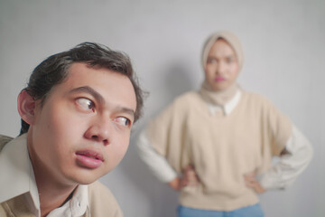 Man Looking Up at Angry Woman in a Hijab