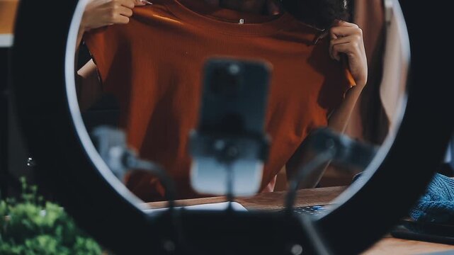 Designer concept.The dressmaker is designing an evening dress in the room.Asian clothing designers are measuring sample sizes to prepare evening gowns for important customer orders