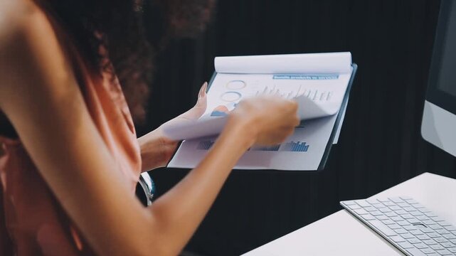 Designer concept.The dressmaker is designing an evening dress in the room.Asian clothing designers are measuring sample sizes to prepare evening gowns for important customer orders