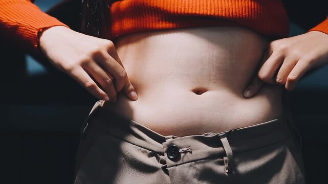 A woman who touches the belly meat, diet image