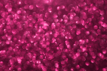 Pink glitter bokeh background with defocused sparkling lights, abstract shiny texture. Holiday lights.