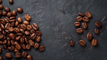 Close-up of roasted coffee beans on dark slate
