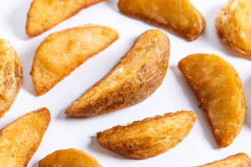 fried potato wedges isolated on white background
