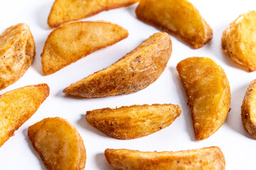 fried potato wedges isolated on white background