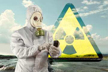 Man in a gas mask and protective suit detecting ionizing radiation on Geiger counter. Apocalypse,...