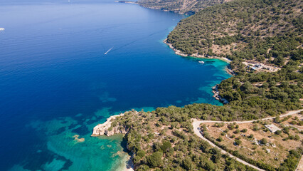Drone view of the sea coast. Rocky shore and sea water. Vacation and travel. Summer seascape. aerial view. Image for cards, background, wallpaper or design.