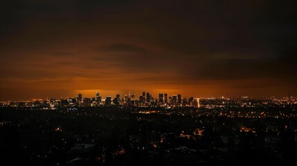 Obraz premium Darkened city skyline during a power outage at night. 