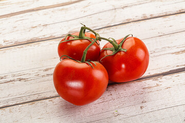 Sweet ripe tomatoes on the branch