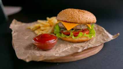 Burger with cheese, with fried potatoes