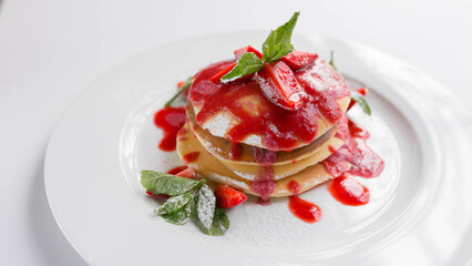 Delicious pancakes with strawberries