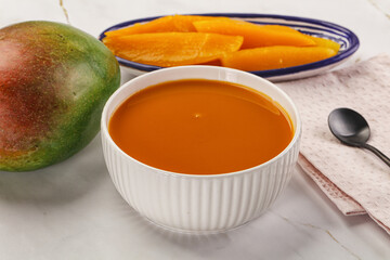 Sweet mango puree in the bowl