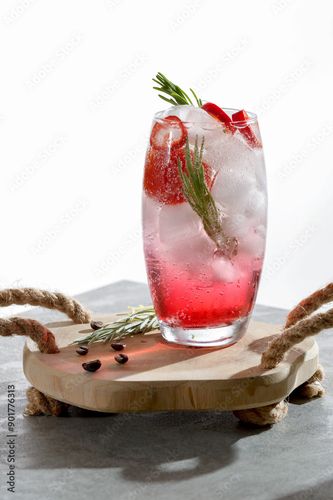 Wall mural cold mocktail water drink with fresh rosemary and red red hot chilli pepper in glass on wooden table