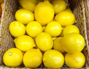 buying fruits(lemon, orange, tangerine, citrus, grapefruite)  at the market