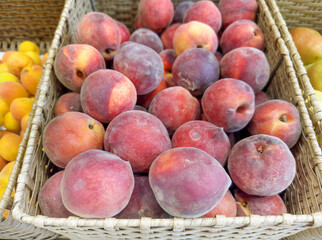 buying apricots, peaches,various fruits on supermarket shelves