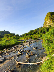 rocky river and blue sky cliffs in the morning as a natural photo background