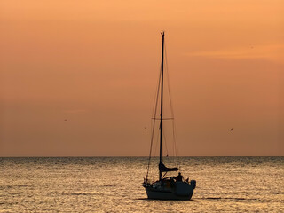 Beautiful sailboat on a tranquil Adriatic sea in Pula, Croatia in the evening sunset