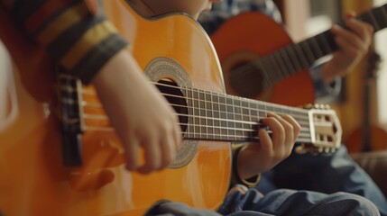 Obraz premium A person's hands play a guitar in close-up, great for music-related uses