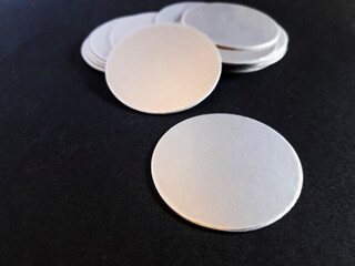 Aluminum foil induction seal isolated black background