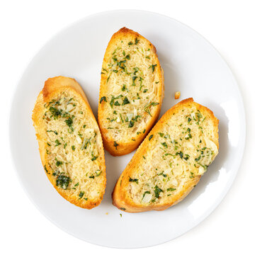 Three slices of garlic bread with fresh parsley on a white ceramic plate isolated on white from above.