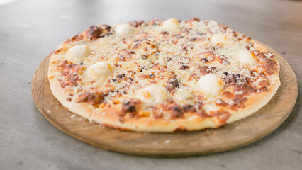 cheese pizza served in a restaurant, close-up in full picture