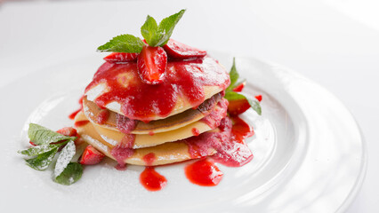 Delicious pancakes with strawberries