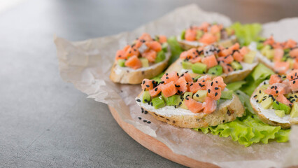salmon and avocado sandwiches, diced, blank space for text