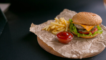 burger with cheese, cheeseburger with fried potatoes