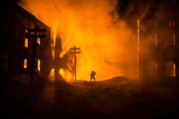 War Concept. Battle scene on war fog sky background, Fighting silhouettes Below Cloudy Skyline at night. City destroyed by war