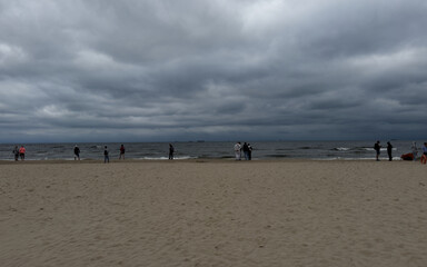 people walking on the beach