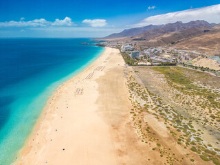 White sandy beach and blue water in Morro Jable, south of Fuerteventura, Canary islands