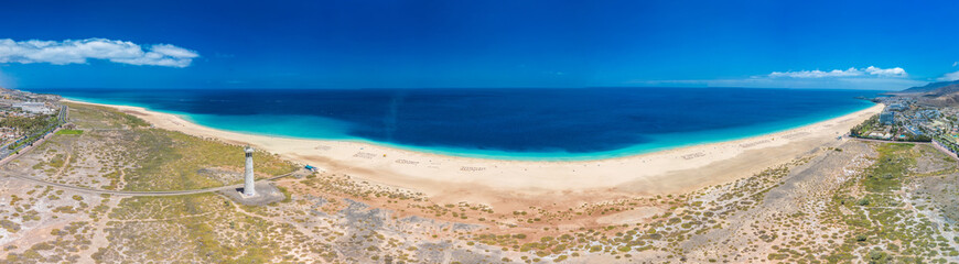 White sandy beach and blue water in Morro Jable, south of Fuerteventura, Canary islands