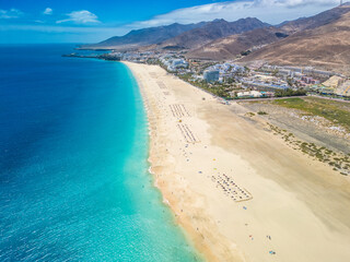 White sandy beach and blue water in Morro Jable, south of Fuerteventura, Canary islands