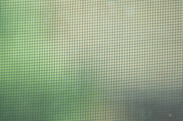 Abstract crochet woven canvas cotton fabric white texture Filament mesh. Natural netting near selective focus. Textile curtains on a window. Aesthetic weave of yarns.