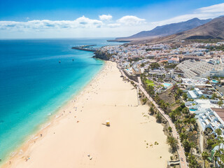 White sandy beach and blue water in Morro Jable, south of Fuerteventura, Canary islands