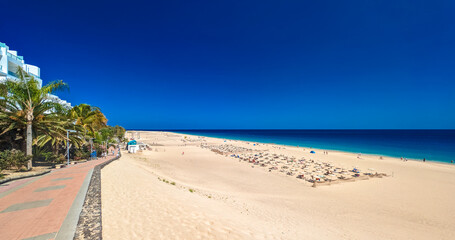 White sandy beach and blue water in Morro Jable, south of Fuerteventura, Canary islands