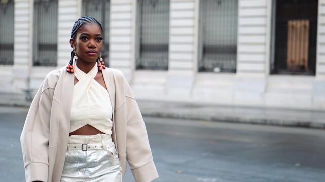 Black bussiness woman walking in the streets of paris
