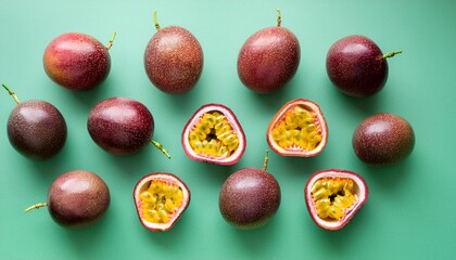 Colorful fruit pattern of fresh passion fruits on green pastel background top view