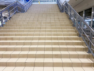 Fototapeta premium A wellconstructed and sturdy staircase equipped with a strong metal railing offers essential support and safety for individuals who are ascending or descending with ease and confidence