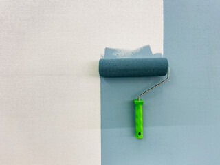 A paint roller is actively in use at this moment to efficiently apply paint onto the surface of a...