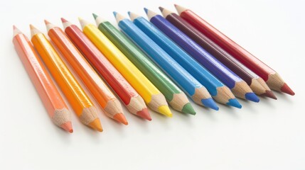 Fototapeta premium Colored pencils in a row on a white background