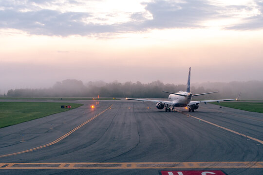 Richmond International Airport, Richmond, Virginia - July 25, 2023 - Jet Blue A320 preparing for take off on a foggy morning at Richmond International Airport