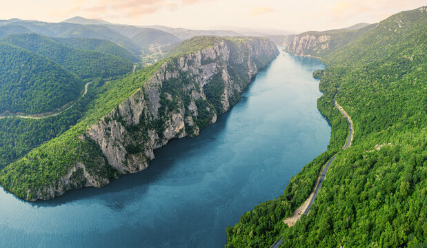 Aerial view of the Danube River flowing through the Iron Gate Gorge in Djerdap National Park, Serbia - Powered by Adobe