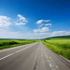 Fototapeta premium A Lone Achingly Empty Tarmac Road Cutting Through Vast Countryside Fields Under Clear Blue Sky: A Visual Metaphor for Solitude and Tranquillity