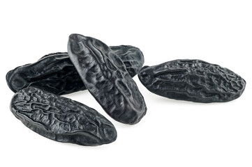 Group of aroma tonka beans isolated on a white background. Beans of Dipteryx odorata or cumaru.