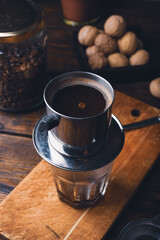 Preparing coffee in Vietnamese drip filter phin
