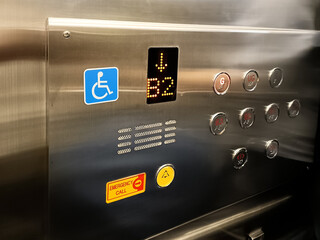 Modern Elevator Control Panel with Disabled Access and Emergency Call Button in Stainless Steel Interior